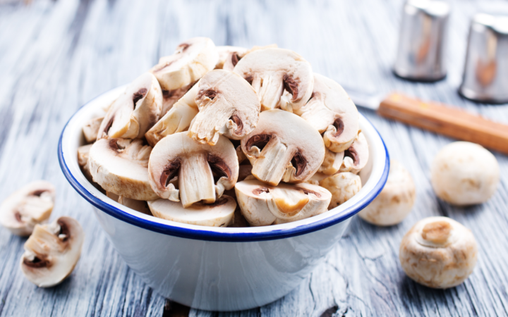 a bowl of white button mushroom slices